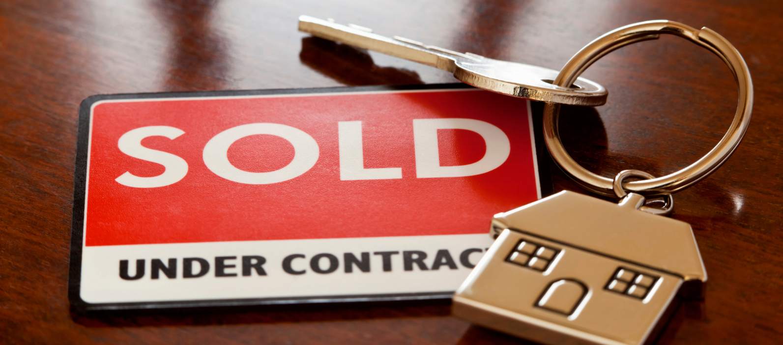 hidden costs of selling a house with Sold sign showing house under contract