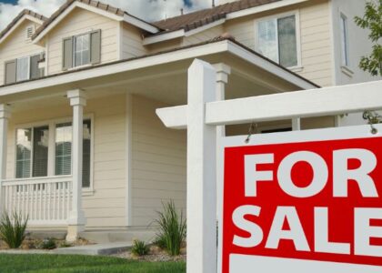 House with a for sale sign