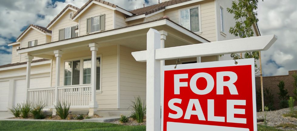 House with a for sale sign