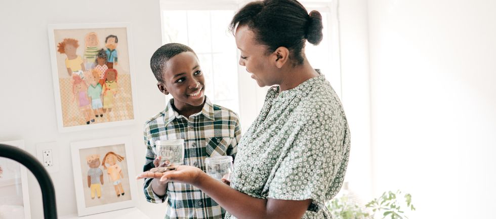 mom teaching her young son about money